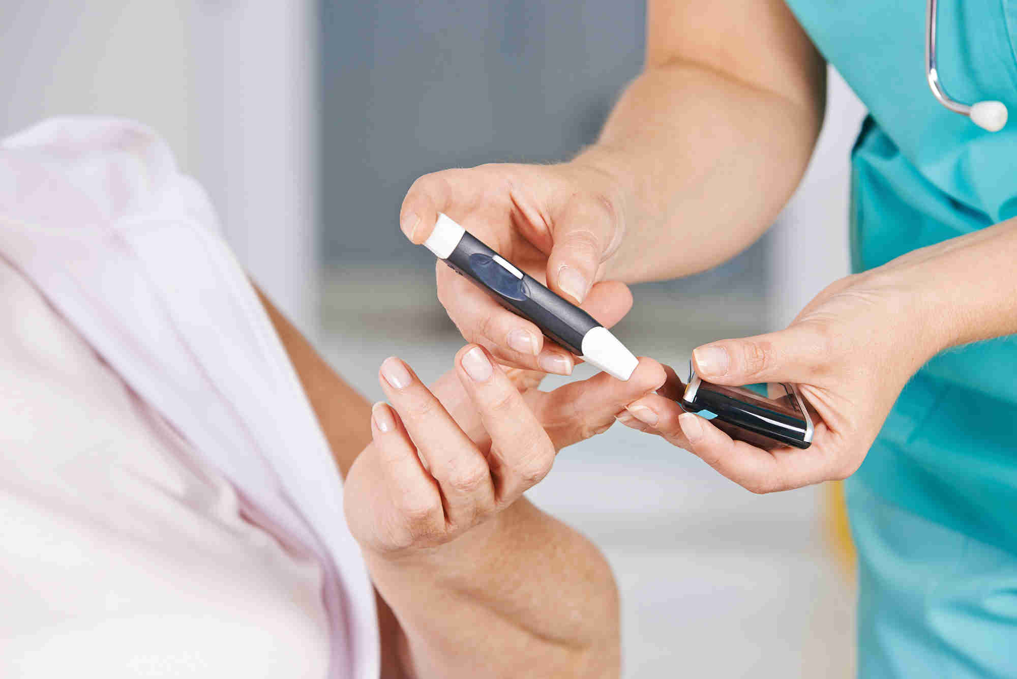Image of adult having their blood glucose level tested