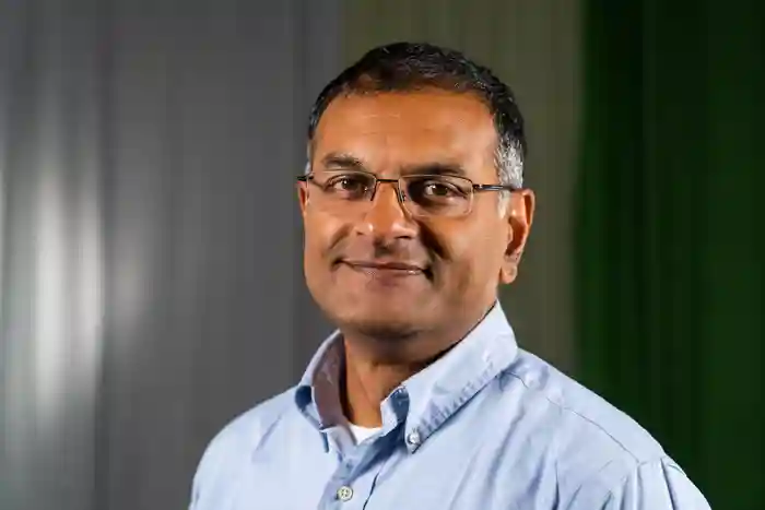 Head and shoulders image of Professor Dhatariya, who is smiling